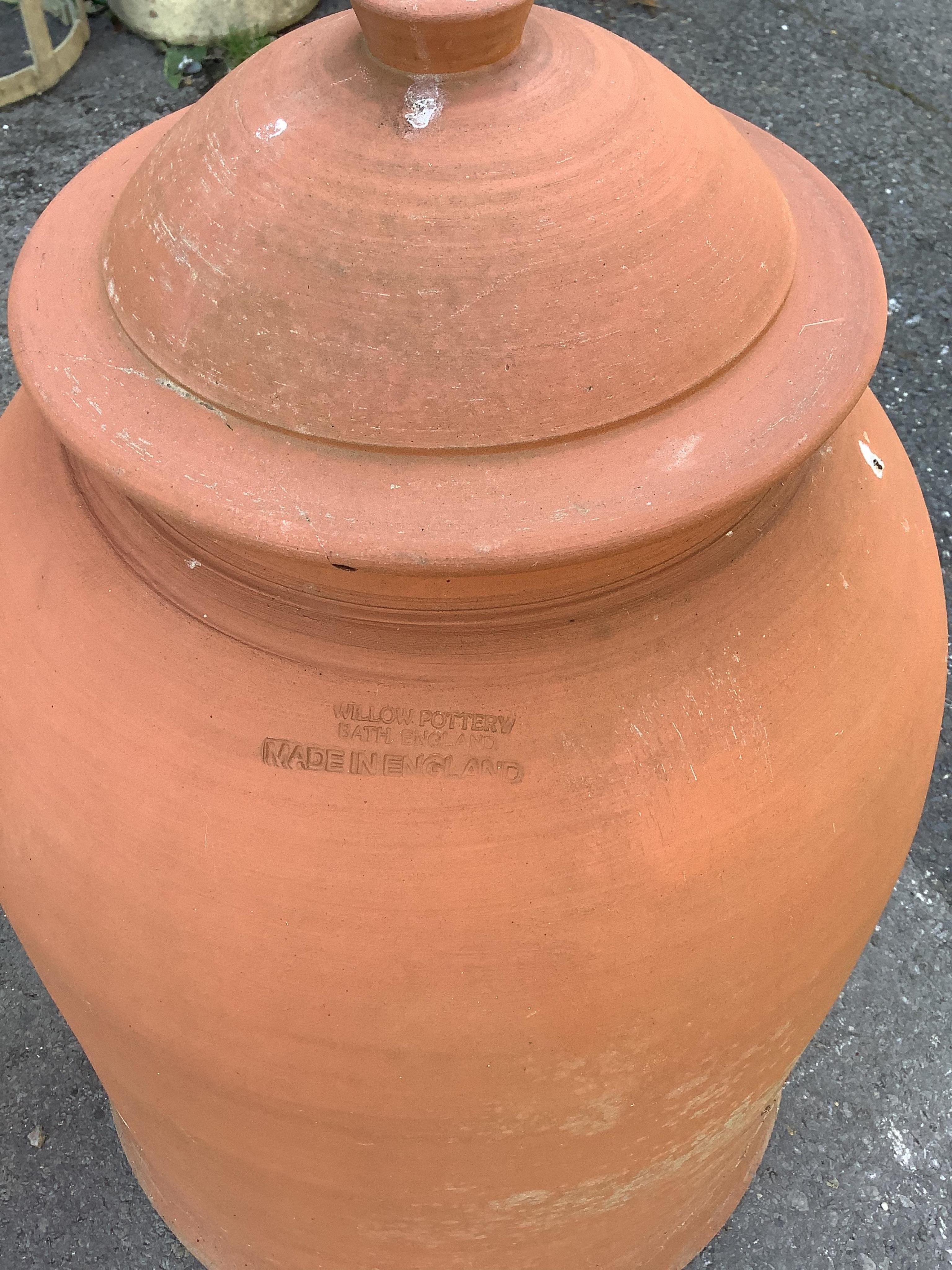 A terracotta rhubarb forcer with lid by Willow pottery, a terracotta finial and a stoneware planter, largest height 60cm. Condition - fair